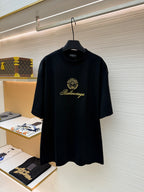 Dark short-sleeve T-shirt with Balenciaga gold crest and script logo
