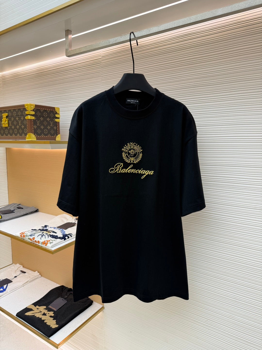 Dark short-sleeve T-shirt with Balenciaga gold crest and script logo
