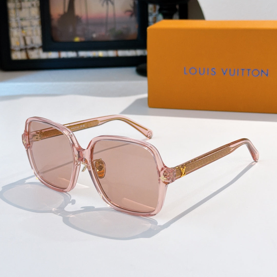 Pink sunglasses with gold temple detailing and light rose lenses