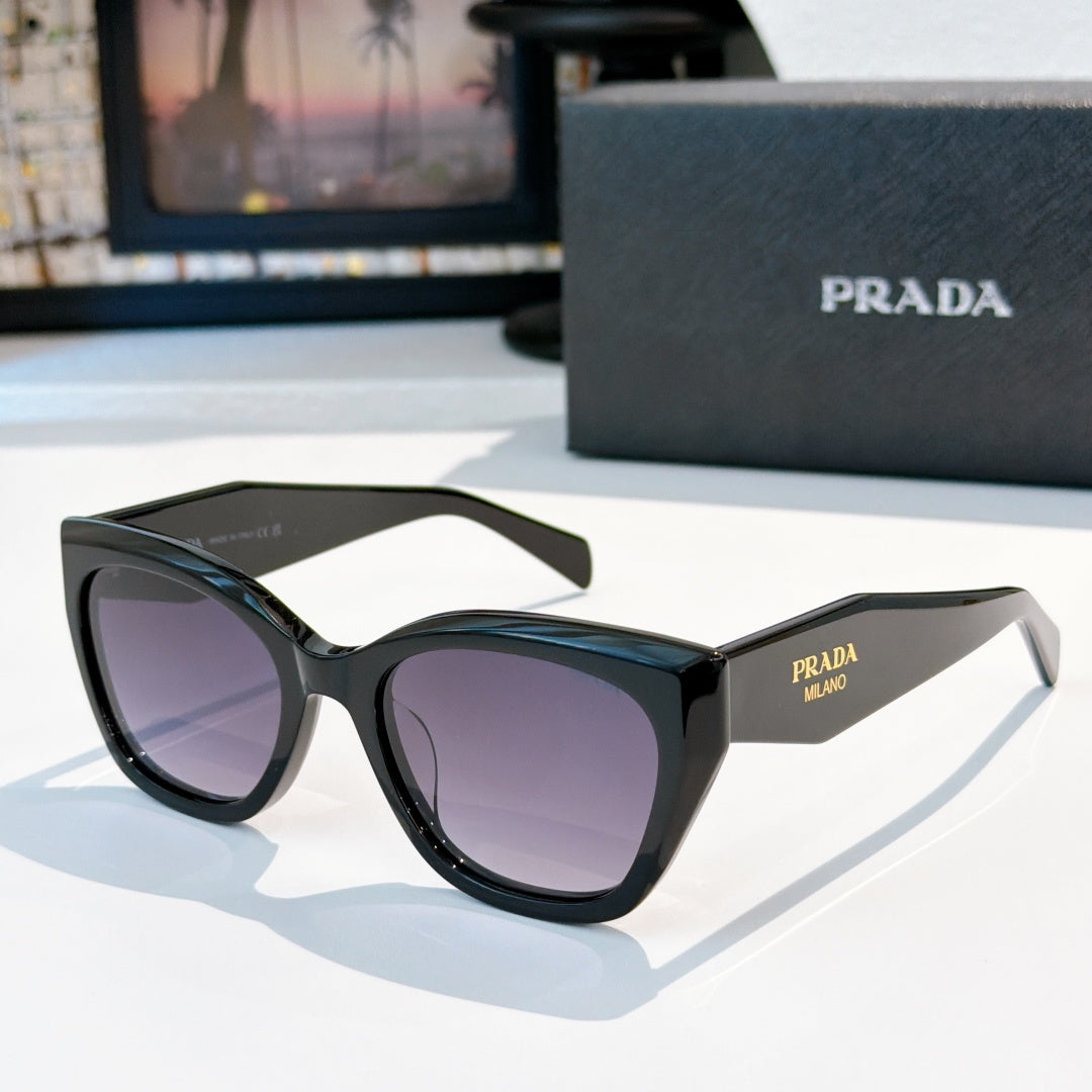 Prada sunglasses with black frames and purple tinted lenses, oversized round cat-eye