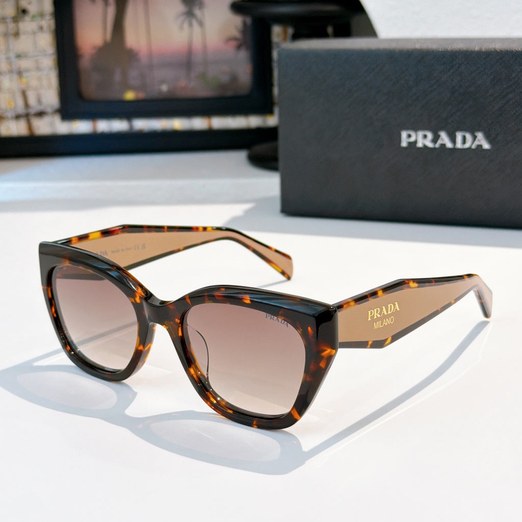 Prada sunglasses with dark tortoiseshell frames and pink tinted lenses, bold cat-eye shape