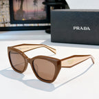 Prada sunglasses with tan frames and brown tinted lenses, oversized round cat-eye style