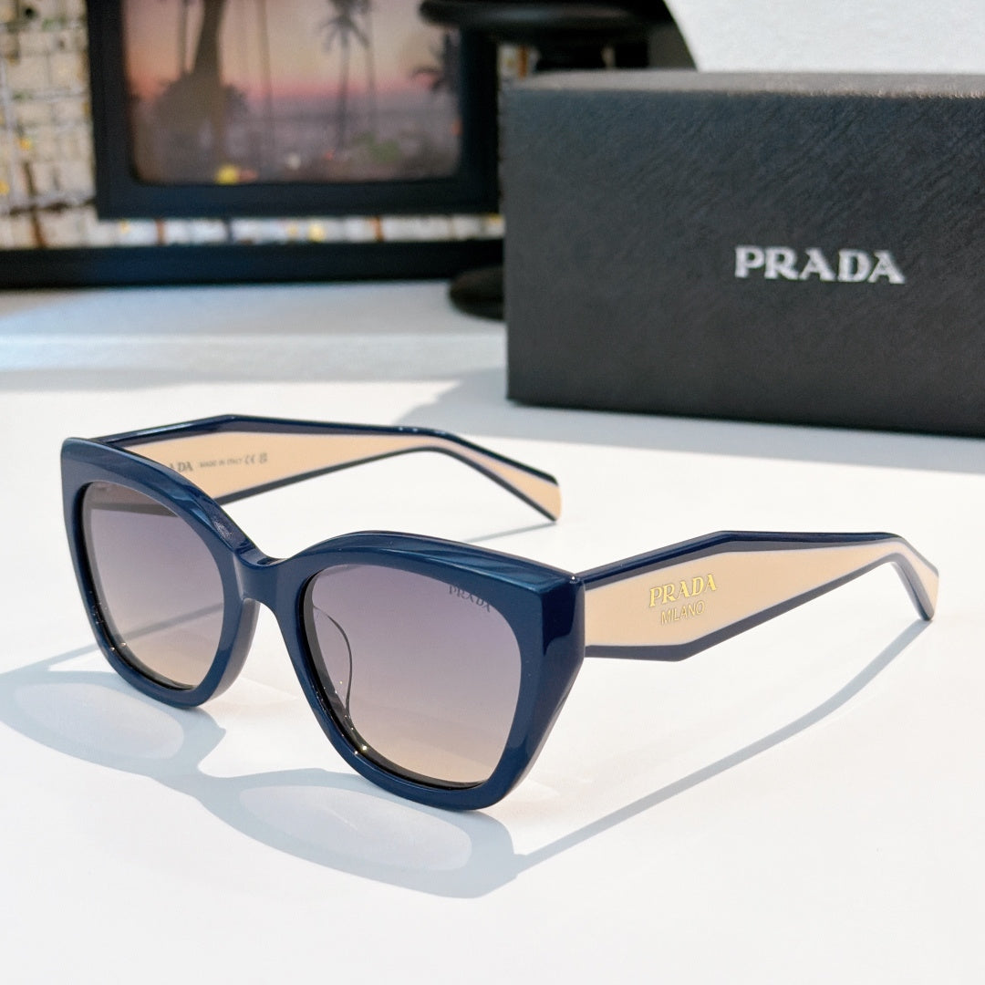Prada sunglasses with dark blue frames and tinted purple lenses, round cat-eye shape