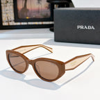 Prada cat-eye sunglasses with brown gradient lenses and tortoise frame.
