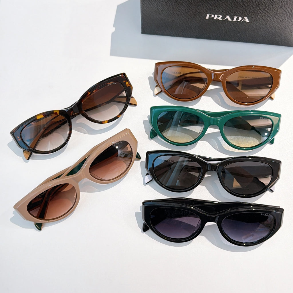 Prada sunglasses assortment with mixed frames and tinted lenses.