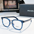 Prada eyeglasses with blue full-rim rectangular frames and silver metal temples.