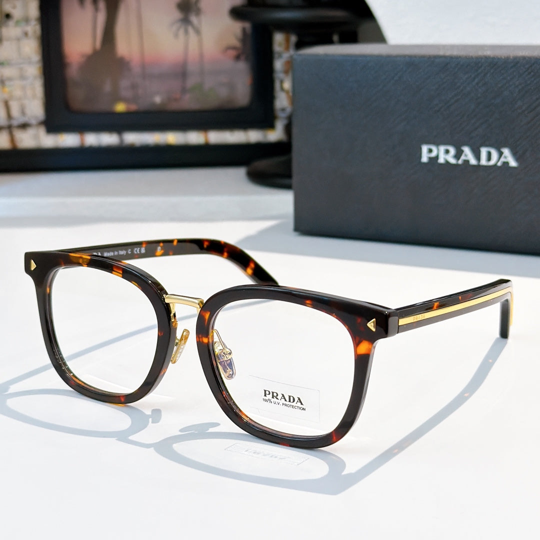 Prada eyeglasses with tortoise full-rim rectangular frames and gold metal temples.