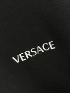 VERSACE logo print on dark gray sweatshirt fabric