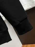 Dark gray sweatshirt sleeve cuffs and hem with rib knit trim