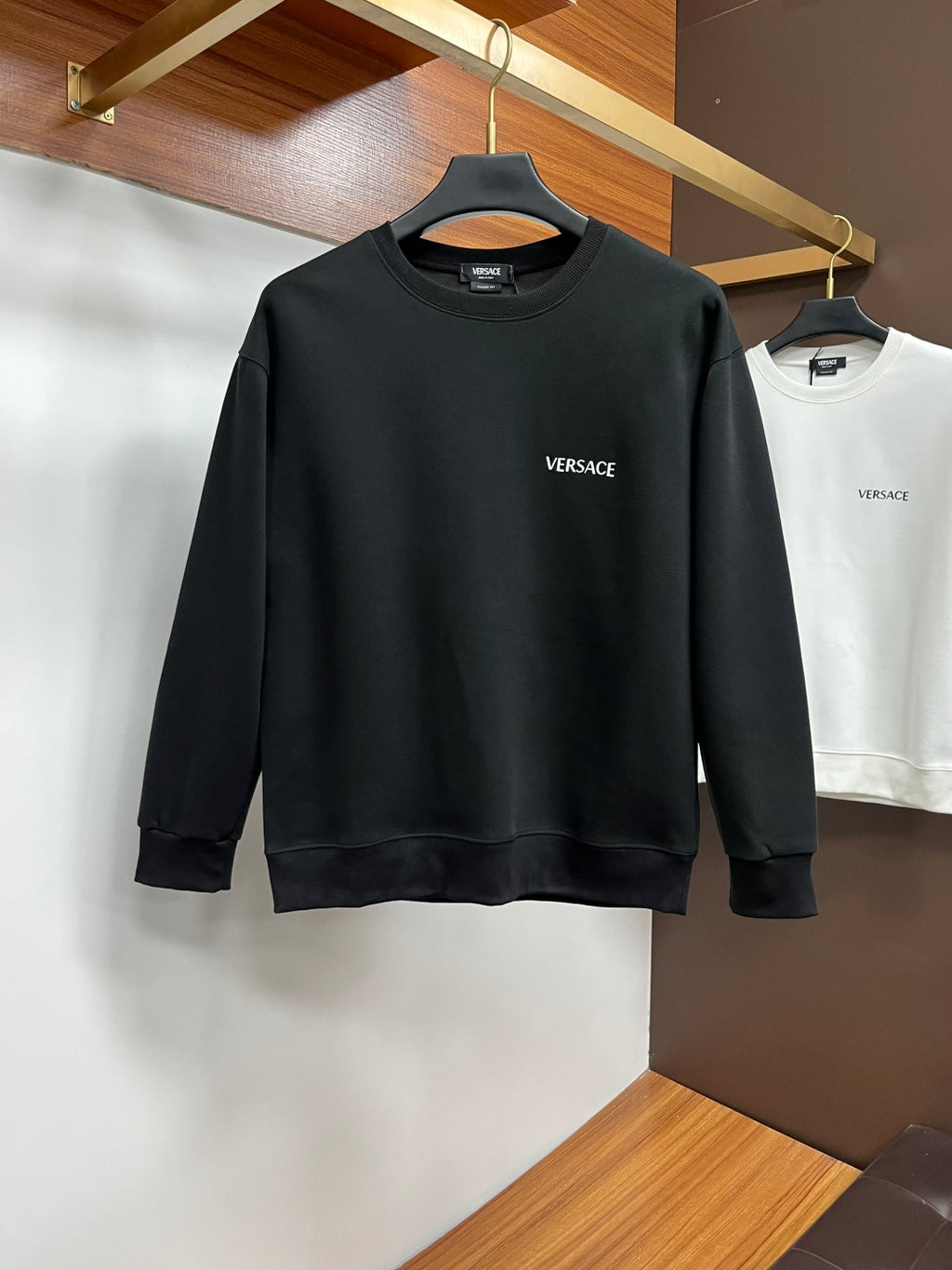 Black sweatshirt with small Versace chest logo, crew neck, long sleeves