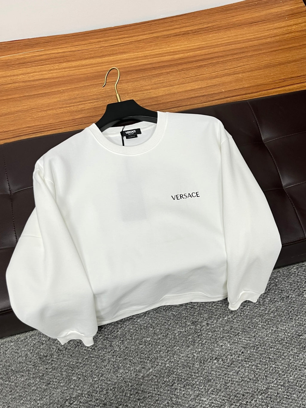 White Versace crewneck sweatshirt with small chest logo and long sleeves.