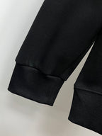 Black sweatshirt sleeve and ribbed hem cuff