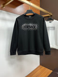 Black VERSACE sweatshirt with studded logo on chest, crew neck, long sleeves
