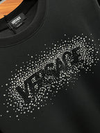 Black sweatshirt front with rhinestone stud logo graphic