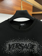 Black VERSACE sweatshirt neckline with studded logo graphic at the chest