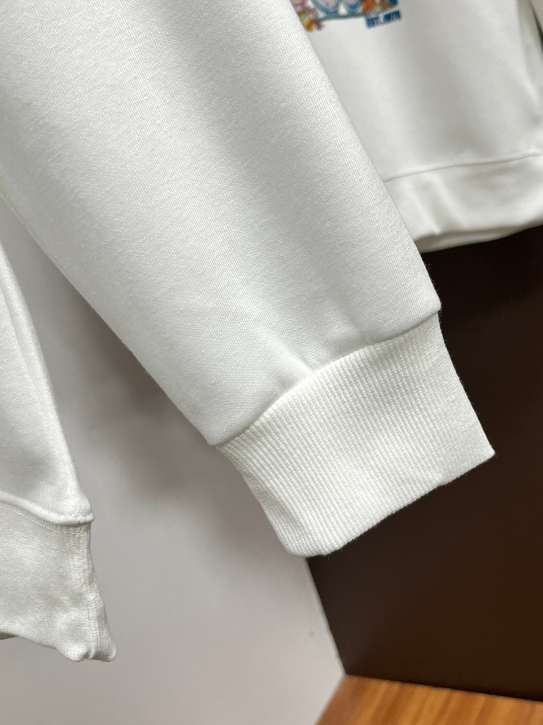 White sweatshirt sleeve with ribbed cuff