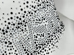Rhinestone-studded logo pattern on white sweatshirt