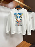 White sweatshirt with colorful crest graphic and blue VERSACE logo on chest