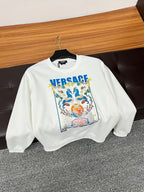 White crewneck sweatshirt with colorful crest graphic and blue VERSACE logo front