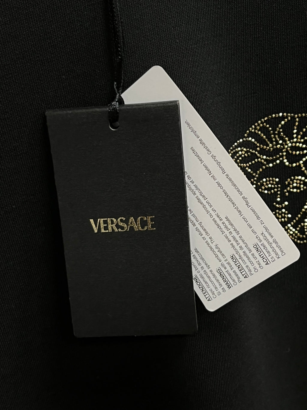 Black sweatshirt with VERSACE paper hang tag