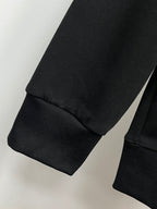 Black sweatshirt with ribbed cuffs and hem