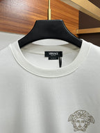 White Versace crewneck sweatshirt neckline with Versace tag and rhinestone Medusa