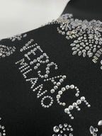 Black sweatshirt with large rhinestone logo design across the front