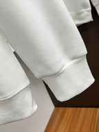 White sweatshirt sleeve and cuff detail