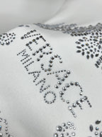 White sweatshirt with large rhinestone lettered design on front