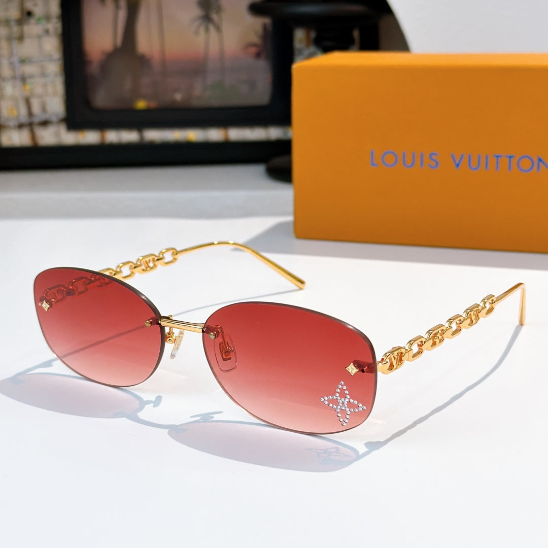 Louis Vuitton sunglasses with gold chain temples and red gradient lenses, star detail