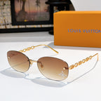 Louis Vuitton sunglasses with gold chain temples and light tan gradient lenses, star detail