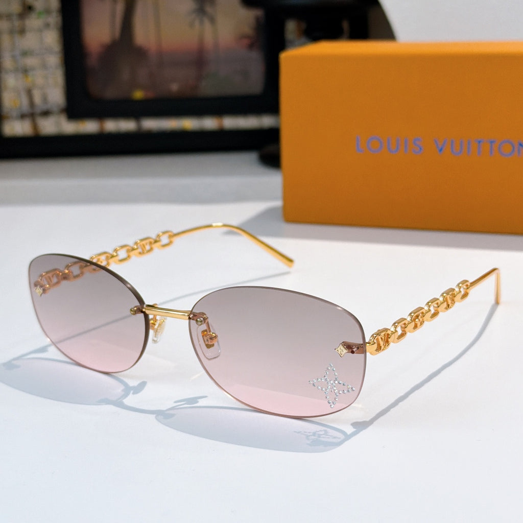 Louis Vuitton sunglasses with gold chain temples and pink-to-clear gradient lenses, star detail