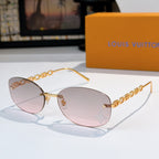 Louis Vuitton sunglasses with gold chain temples and pink-to-clear gradient lenses, star detail