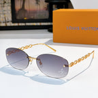 Louis Vuitton sunglasses with gold chain temples and purple tinted gradient lenses, star detail