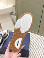 Outsole of low-top sneakers showing Dior text and zigzag tread on the gum rubber sole