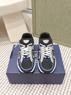Dior unisex sneakers, navy and black with white laces and swoosh-like panels