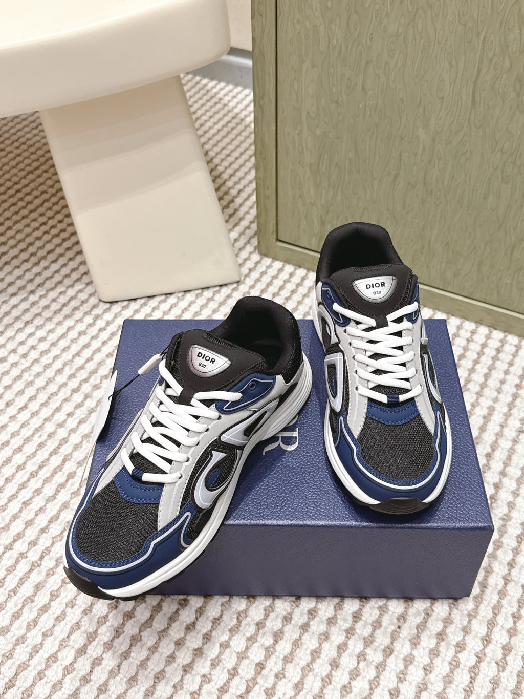 Dior unisex sneakers, side view pair in navy and black with white laces