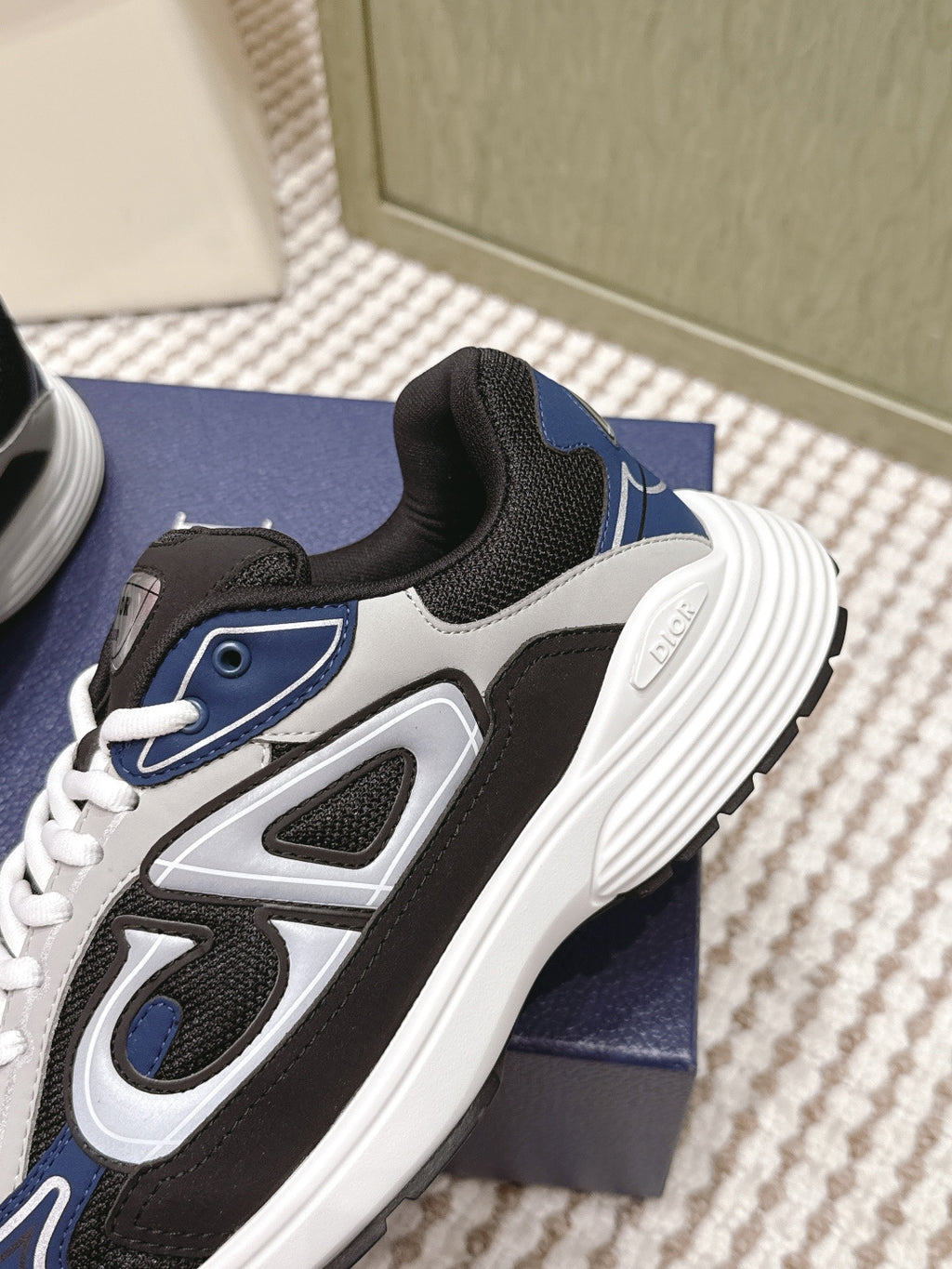 Dior unisex sneakers side detail, black and navy with white midsole and thick sole