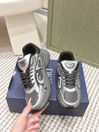 Grey Dior sneakers with black collar, front and side lace eyelets visible