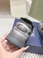 Dior sneakers heel view, grey mesh with ribbed sole and Dior logo patch