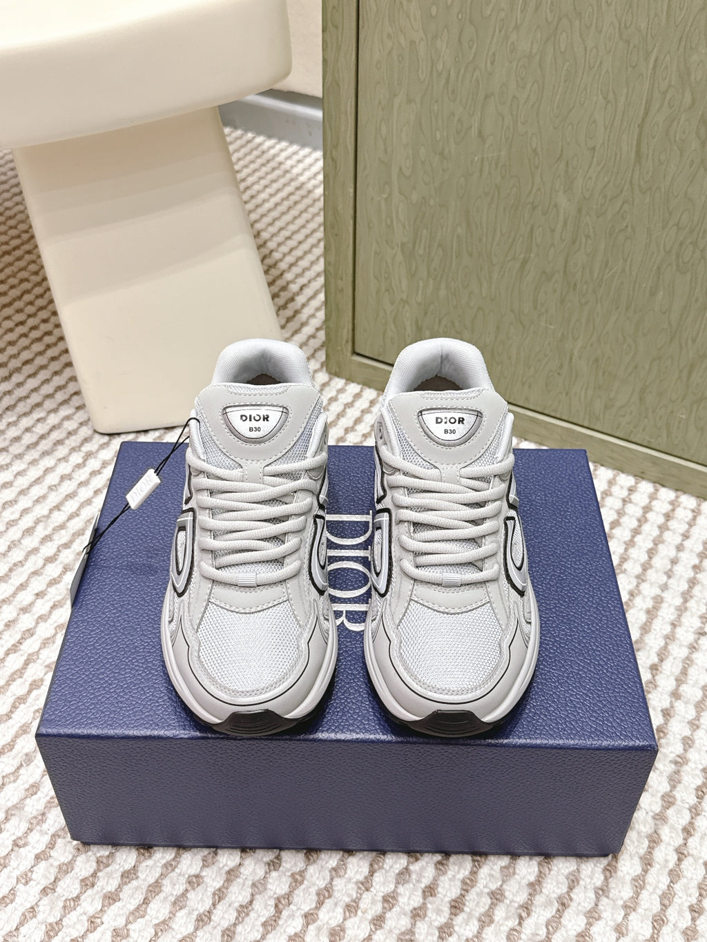 Unisex lace-up sneakers in light gray/white with Dior logo on tongue and sides