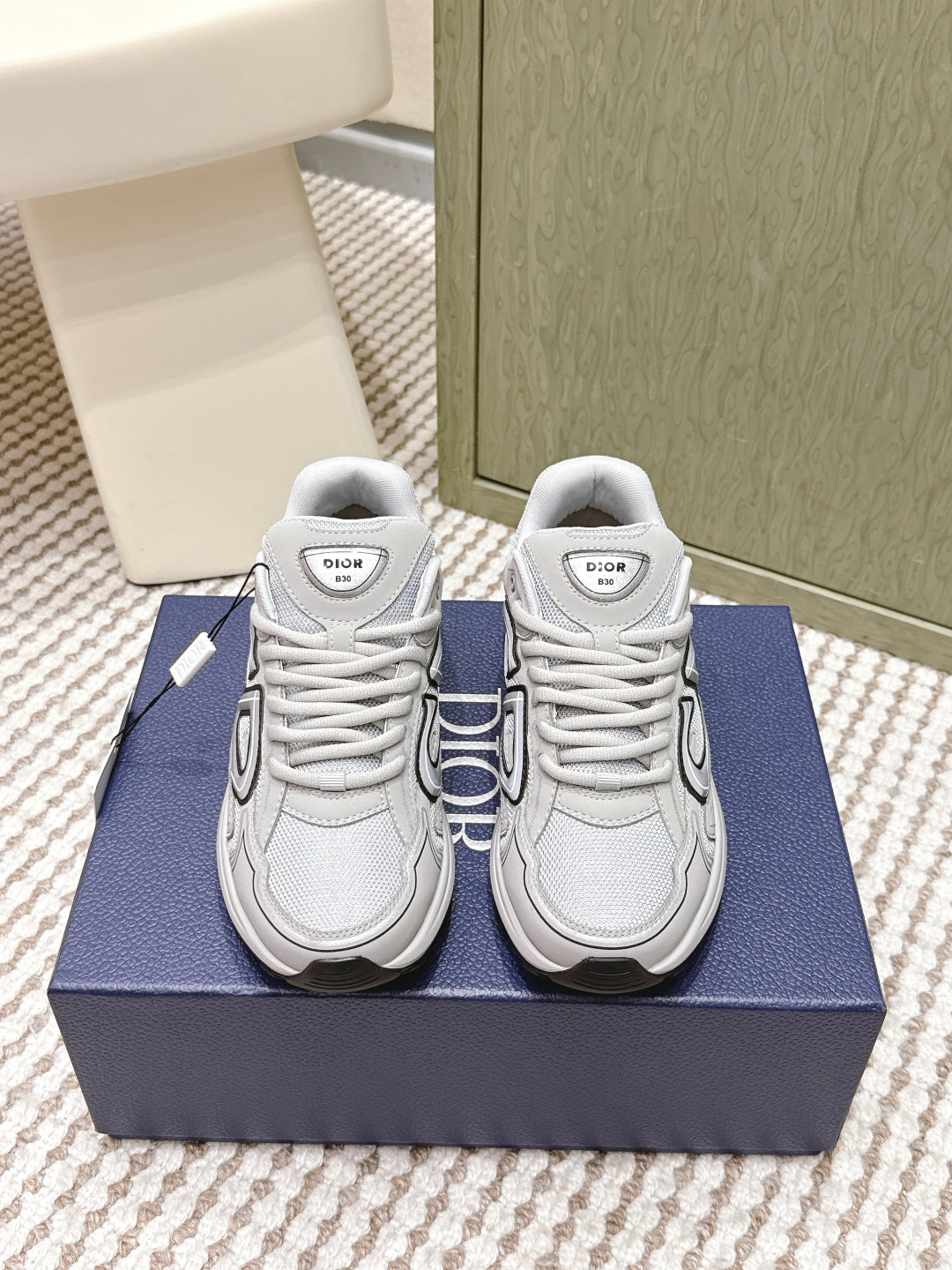 Unisex lace-up sneakers in light gray/white with Dior logo on tongue and sides