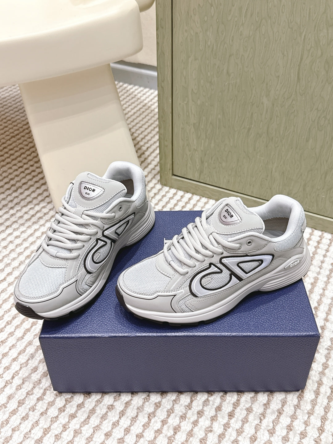 Unisex lace-up sneakers in light gray/white with bold Dior-style side logo detail