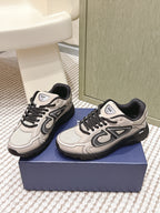Unisex low-top sneakers, light beige with black trim, side logo and laces