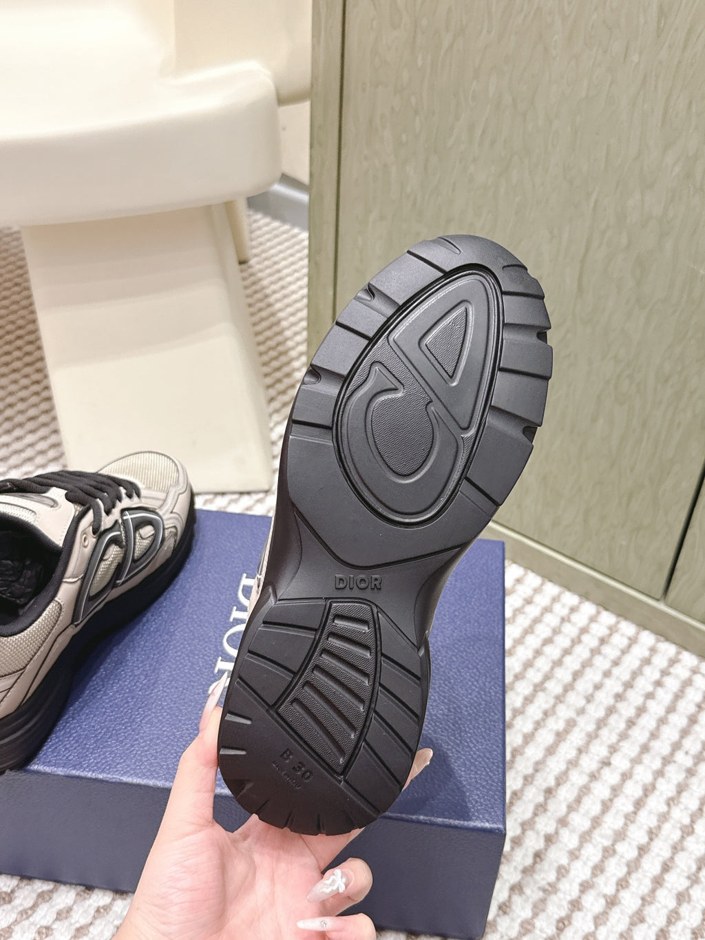 Unisex sneaker outsole, dark rubber tread with Dior heel logo