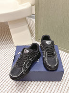 Black lace-up sneakers with white trim and Dior logo label at the tongue