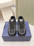 Black lace-up sneakers with white paneling and Dior logo patch