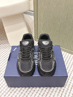 Black lace-up sneakers with white paneling and Dior logo patch