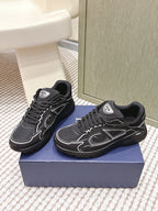 Black lace-up sneakers with chunky sole and white signature-style side details