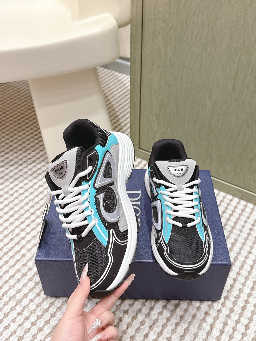 Dior unisex sneakers held up, black and white with turquoise details, lace-up